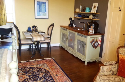 Cast Apartment | Deluxe Studio room, with kingsize bed and roll top bath.