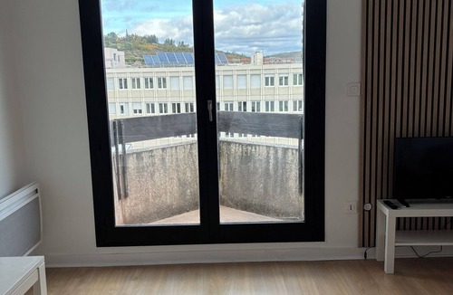 Chamalieres Apartment | Panoramic view of Clermont-Fd with king-size bed