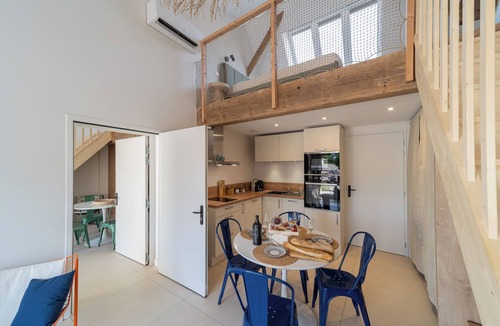 Saintes Apartment | Two new, adjoining lofts in a former cannery: terraces and parking.