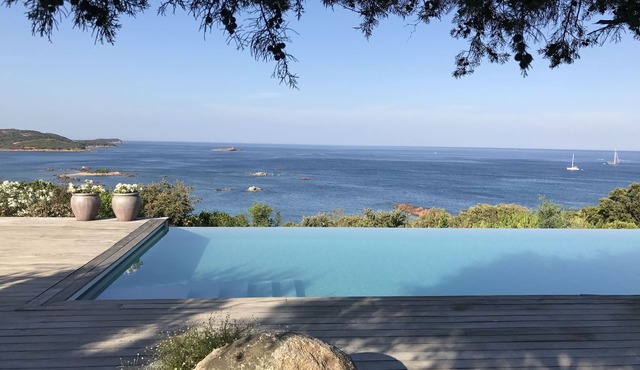 Air-conditioned waterfront villa with pool and beach