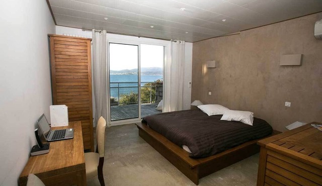 Waterfront villa with direct access to a sandy beach. Breathtaking sea view;